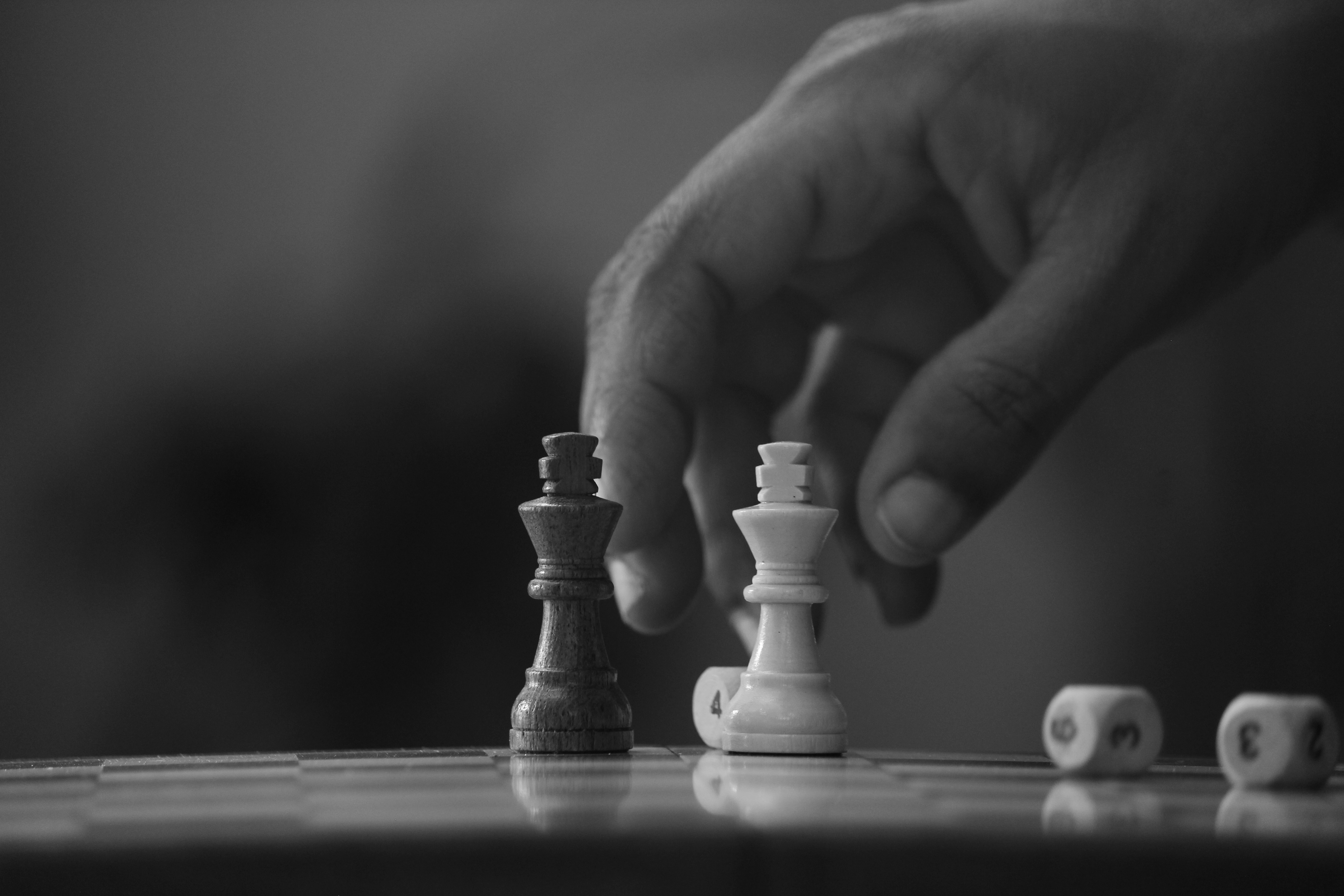 A chessboard mid-game, gold pieces facing black: thinking several moves ahead